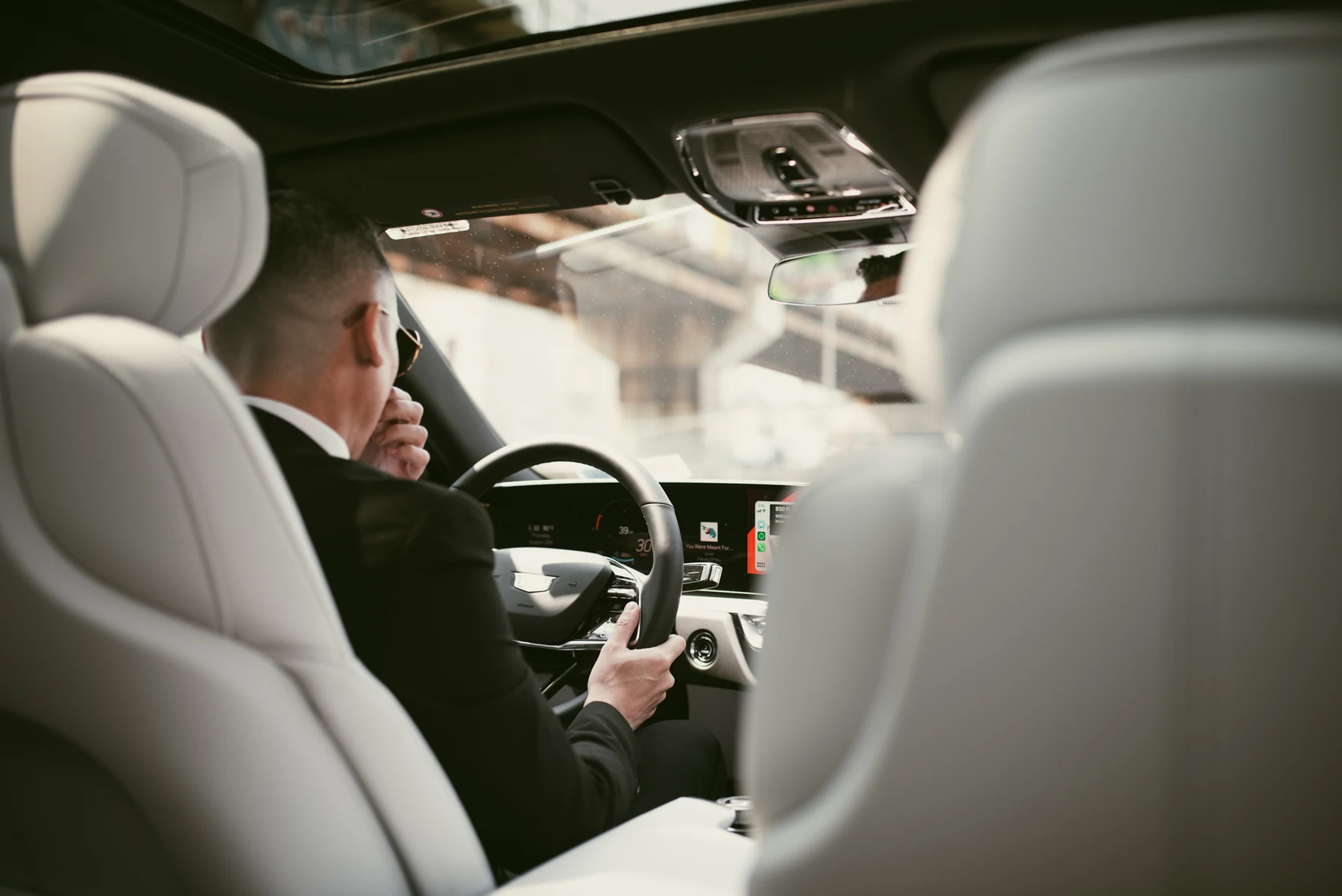 Relier chauffeur opening the door for a passenger