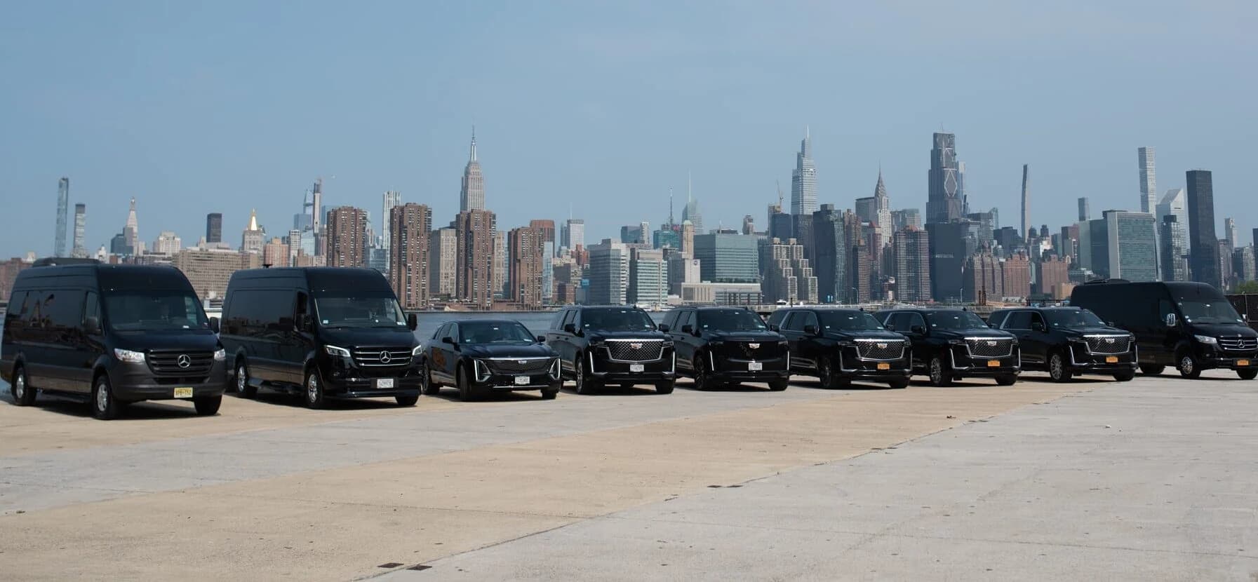 Relier chauffeur opening the door of a luxury vehicle